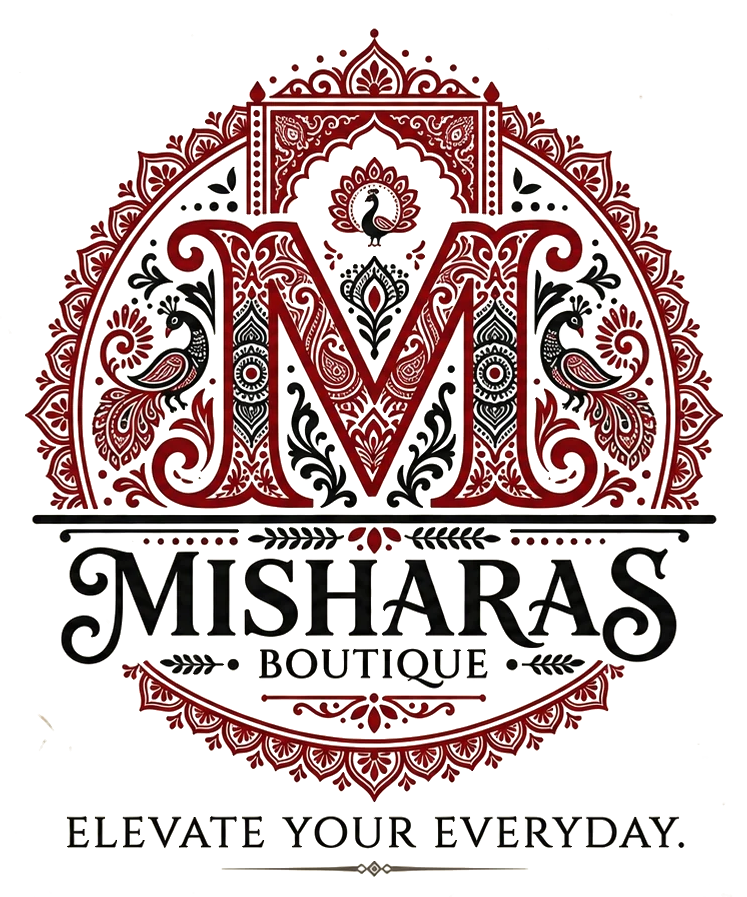 Misharas Boutique — Elevate Your Everyday. Ornate maroon and black crest with the letter M, peacocks, and mandala motifs.